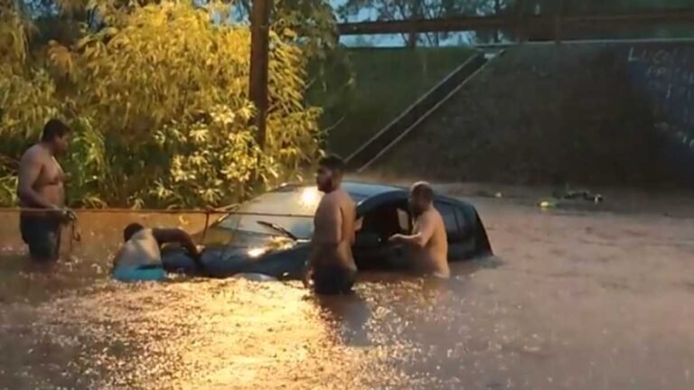 VÍDEOS – Pessoas salvam motorista no túnel mais famoso de Dourados durante alagamento [ASSISTA]