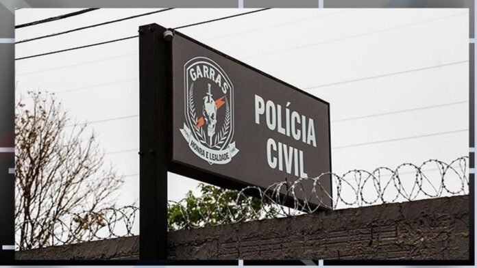 Polícia Civil sign with crest on a dark panel behind barbed wire.