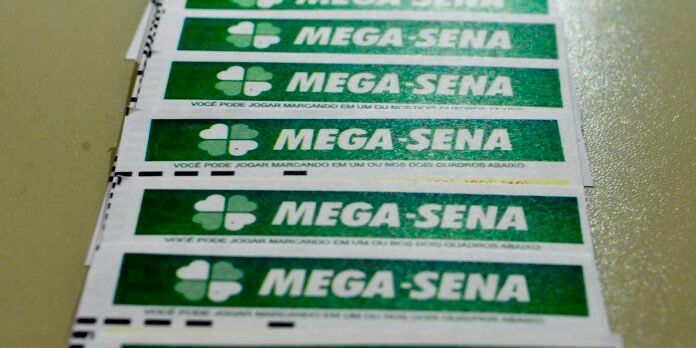 Stack of MEGA-SENA lottery tickets with green panels and a white clover logo.