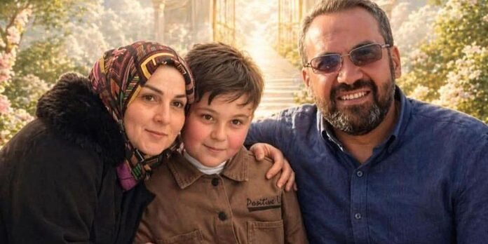 Family portrait: a woman in a colorful hijab, a smiling boy, and a bearded man in sunglasses pose together outdoors.