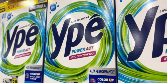 Close-up of laundry detergent boxes with a blue 'ype' logo and a green-blue circular swirl design on a white background.