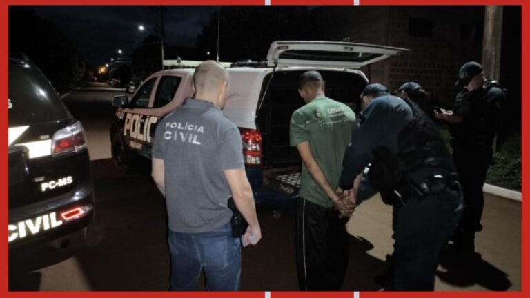 Nighttime scene of Polícia Civil officers detaining a man and guiding him into a police van.
