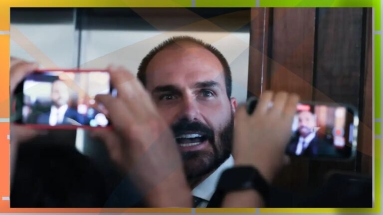 Bearded man speaks to cameras as two smartphones record him in close-up on the foreground