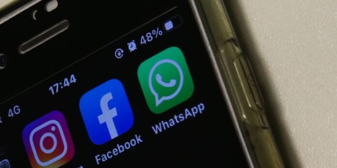 Smartphone home screen showing Instagram, Facebook, and WhatsApp icons as colorful app tiles dating on the home grid.