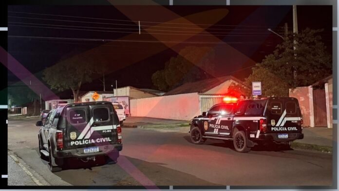 Two Polícia Civil pickup trucks with red emergency lights on a quiet residential street at night.