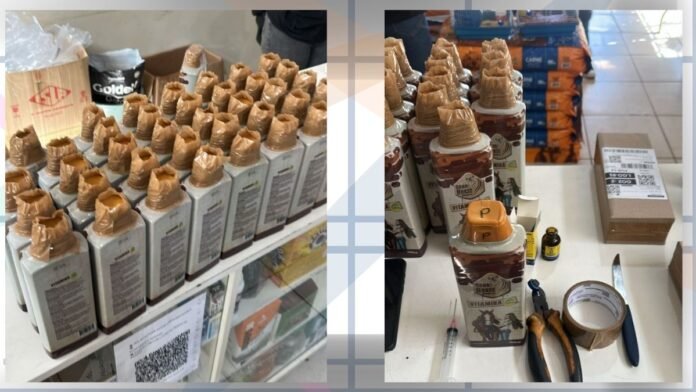 Rows of identical bottles with tan caps lined up on a store shelf, some packaging and a QR code nearby.