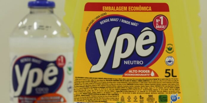 Close-up of yellow Ypê Neutro laundry detergent packaging with large blue logo and 5L label on a bright background.
