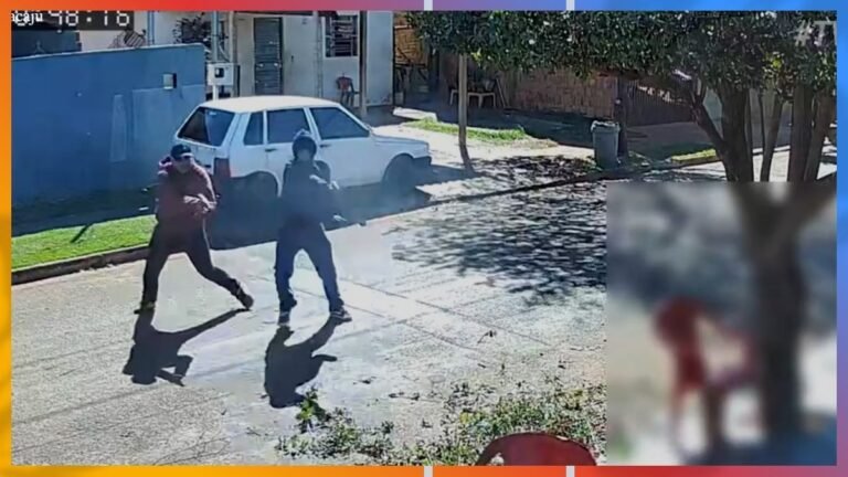 Two men armed with guns walk across a sunlit residential street beside a parked white car, with a second blurred figure visible in an inset on the right.