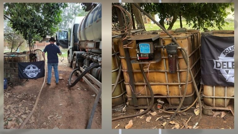 Man in a blue shirt and jeans stands beside a large white fuel tanker truck, with hoses on the ground and a police banner nearby in a yard.