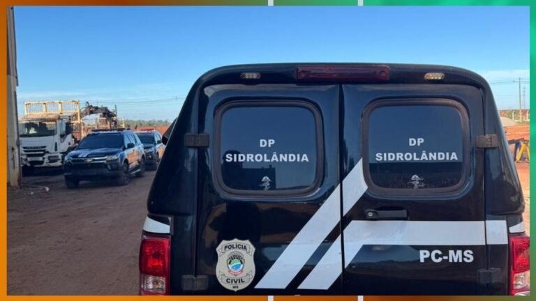 Back of a black police van with DP Sidrolândia and PC-MS markings, badge visible, on a dirt road with other vehicles in the background.