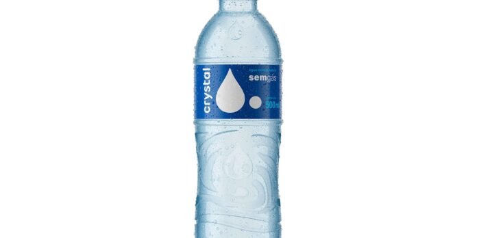 500 ml bottle of still mineral water with a blue label and water droplets on the plastic surface