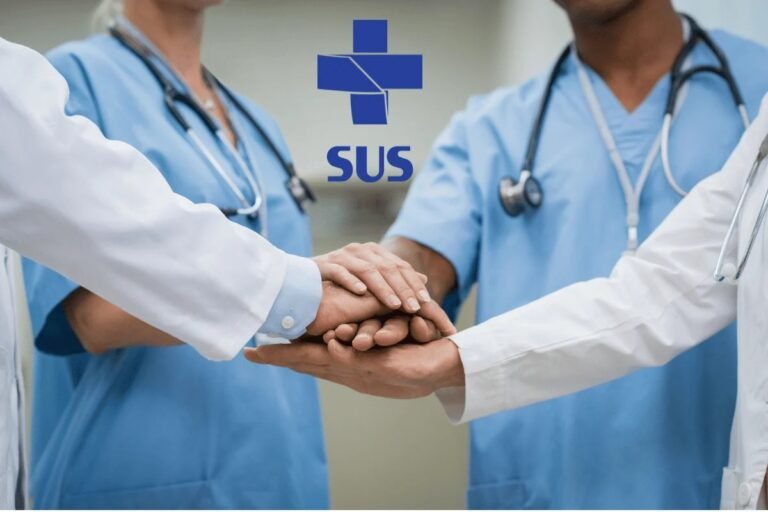Medical team in scrubs and white coats placing hands together in a show of unity, with the SUS logo overhead.