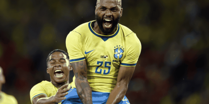 Brazilian soccer players celebrate on the field in yellow jerseys, one shouting with fists raised