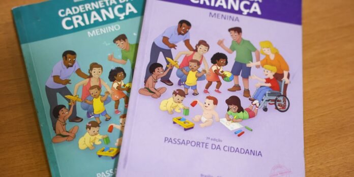 Two colorful children's booklets about childhood and citizenship; one blue-green for boys and one purple for girls, shown on a wooden surface.