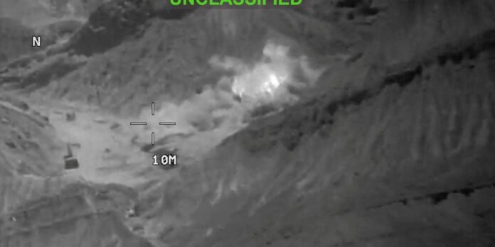 Night-vision image of a hillside with a targeting crosshair over a likely area; scale shows 10 m and a north marker (N).