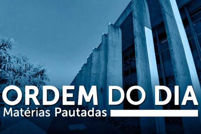 Blue-tinted modern building facade with bold white text 'ORDEM DO DIA' and subtitle 'Matérias Pautadas' across the bottom.