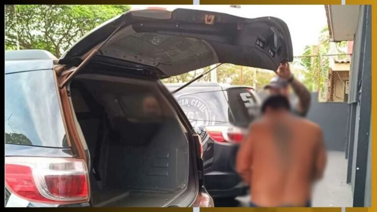 Shirtless man with blurred face stands near an open SUV trunk, police car in the background.
