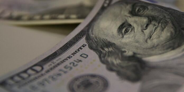 Close-up of a U.S. hundred-dollar bill featuring Benjamin Franklin's portrait