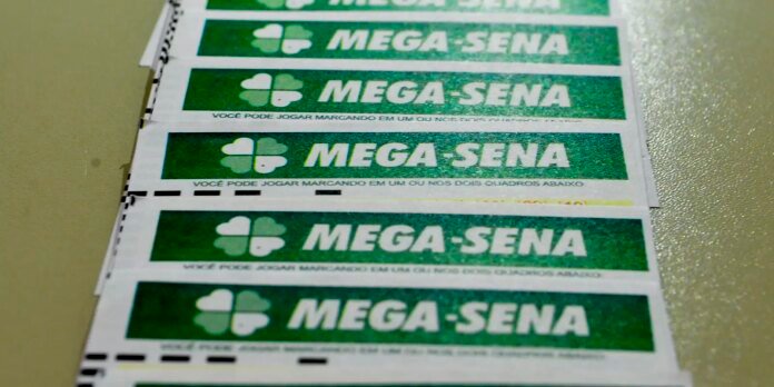 Stack of MEGA-SENA lottery coupons with green backgrounds and a white clover logo on each ticket (Brazilian lottery).