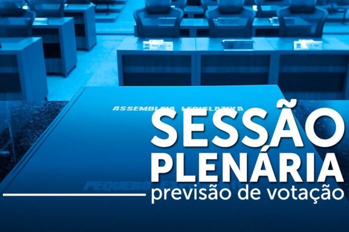 Large banner in a council chamber reading Sessão Plenária: previsão de votação, in a blue-tinted conference hall setting.