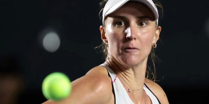 Close-up of a female tennis player in a white visor, intensely focused with a neon tennis ball in the foreground.
