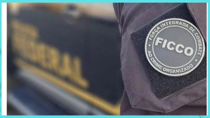 Close-up of a dark uniform with a circular patch that reads FICCO, a unit for fighting organized crime.
